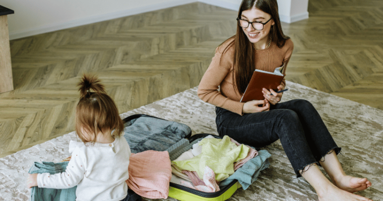 Mom and baby packing for trip