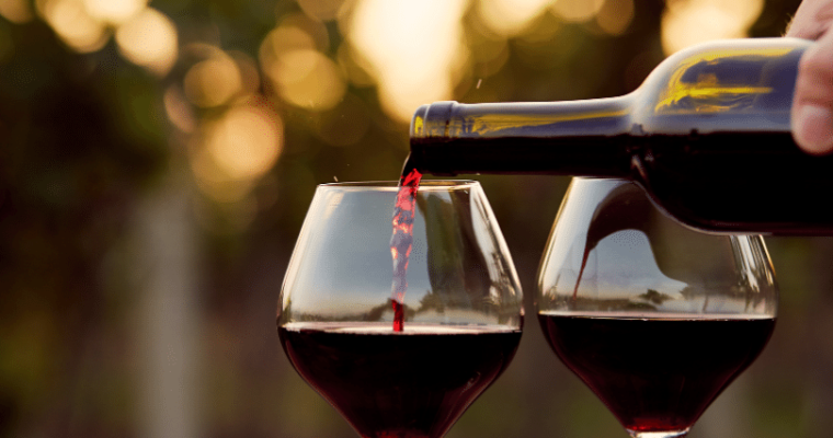 pouring red wine in a glass