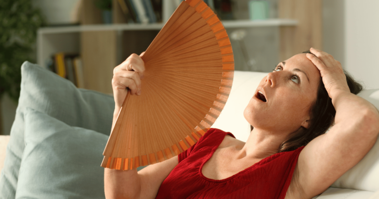 menopause woman with fan